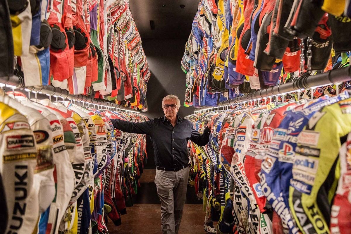 Rows of racing suits hanging in the Dainese archive